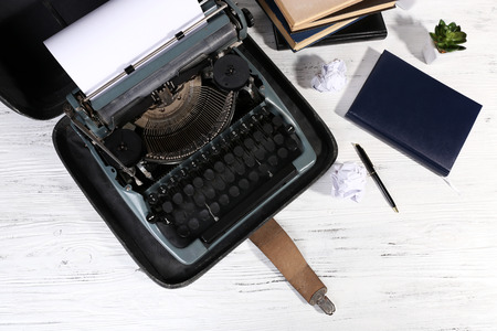 Retro typewriter on wooden table, closeup