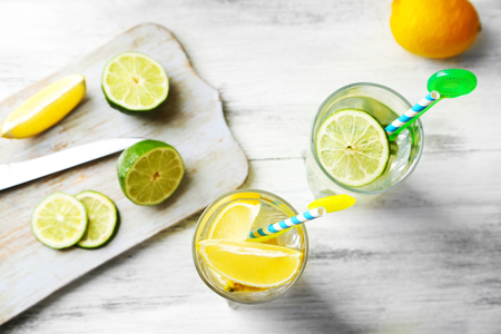 Cocktails with fresh citrus fruits on wooden backgroundの写真素材