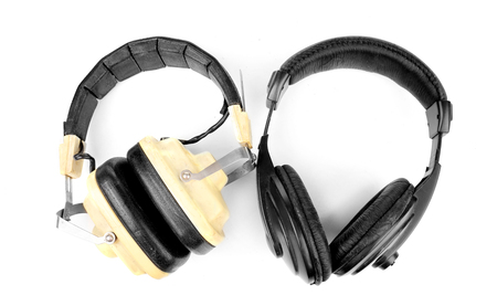 Old headphones isolated on whiteの写真素材