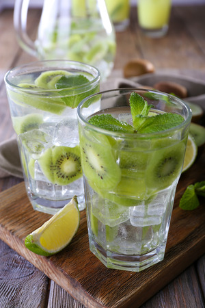 Glasses of cocktails on wooden table, closeupの写真素材