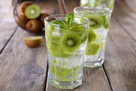 Glasses of cocktails on wooden table, closeupの写真素材