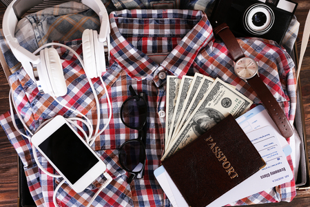 Packed suitcase of vacation items, top viewの写真素材