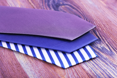 Various of ties on wooden backgroundの写真素材