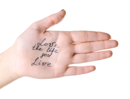 Female hand with written message isolated on whiteの写真素材