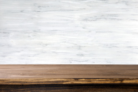Empty wooden table with light background
