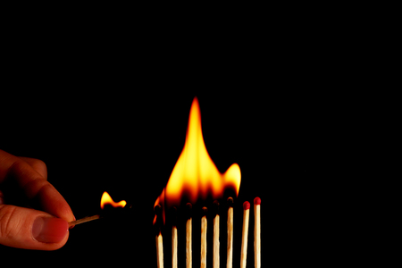 Burning matches on black backgroundの写真素材