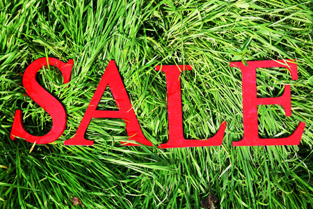 Sale on green field backgroundの写真素材