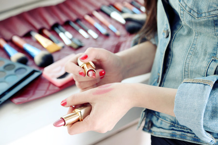 Female makeup artist with cosmetics at work close-upの写真素材