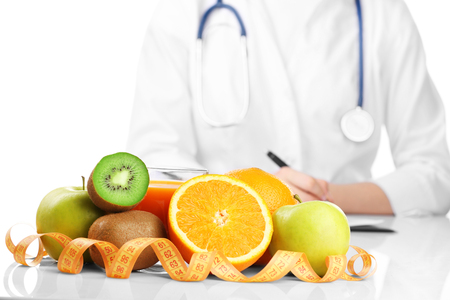 Nutritionist doctor writing  diet plan, isolated on whiteの写真素材