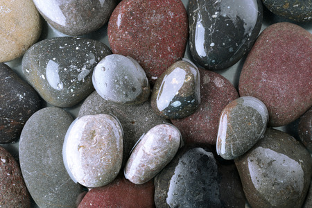 Wet sea pebbles backgroundの写真素材