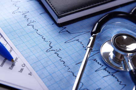 Cardiogram with stethoscope on table, closeupの写真素材
