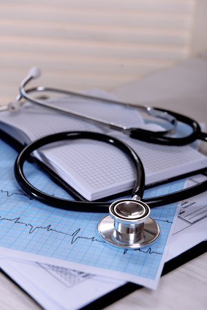 Cardiogram with stethoscope on table, closeupの写真素材