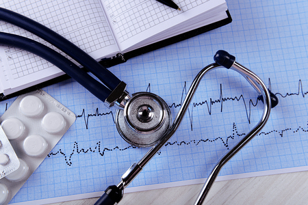 Cardiogram with stethoscope on table, closeupの写真素材