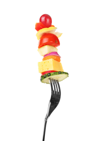 Snack of vegetables on fork isolated on whiteの写真素材