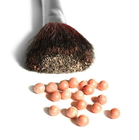 Cosmetic powder balls and makeup brush, isolated on whiteの写真素材