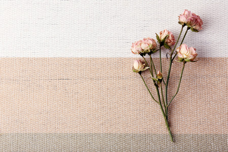 Beautiful dry flowers on napkin on wooden table close upの写真素材