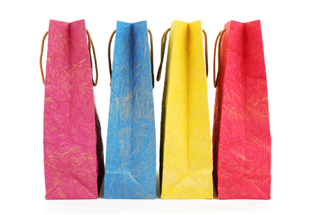 Colorful shopping paper bags isolated on whiteの写真素材