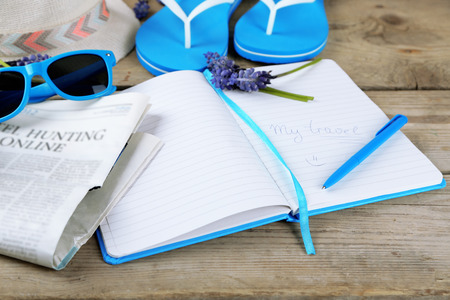 Tourist stuff on wooden backgroundの写真素材