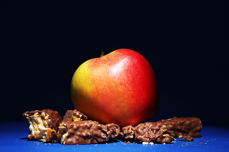 Concept of healthy and unhealthy food on dark backgroundの写真素材