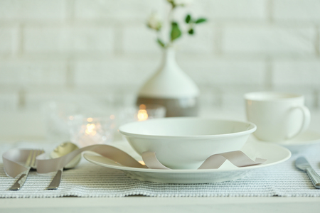Beautiful holiday table setting in white and gray colorの写真素材