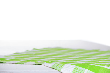 Wooden table with napkin isolated on whiteの写真素材