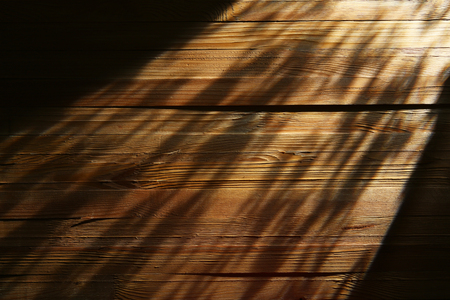 Light beam on wooden backgroundの写真素材
