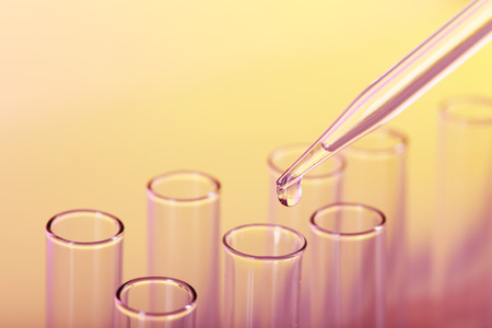 Test tubes on color background