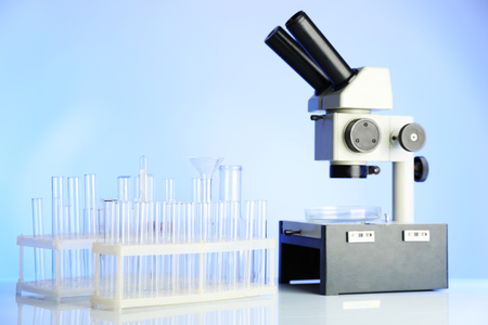 Test tubes and microscope in laboratoryの写真素材