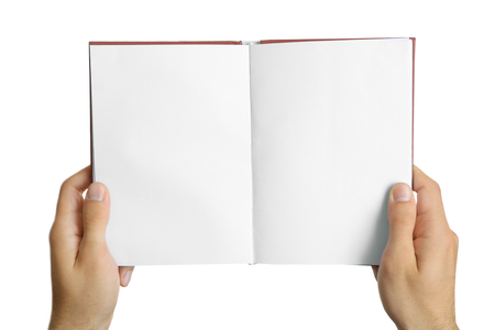 Male hands holding book isolated on whiteの写真素材