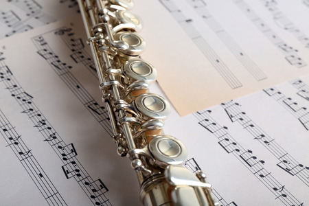 Flute on music notes backgroundの写真素材