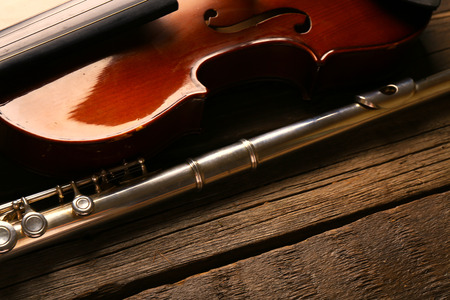 Flute with violin on table close upの写真素材