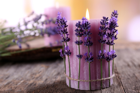 Candles with lavender flowers on table close upの写真素材