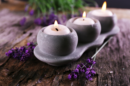 Candles with lavender flowers on table close upの写真素材