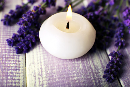 Candles with lavender flowers on table close upの写真素材
