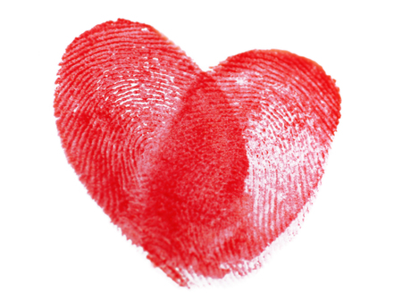 Heart of fingerprints on white paper backgroundの写真素材
