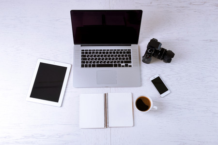 Office supplies and gadgets on white table, top viewの写真素材