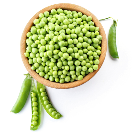 Fresh green peas in bowl isolated on whiteの写真素材