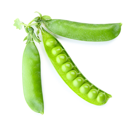 Fresh green peas isolated on whiteの写真素材