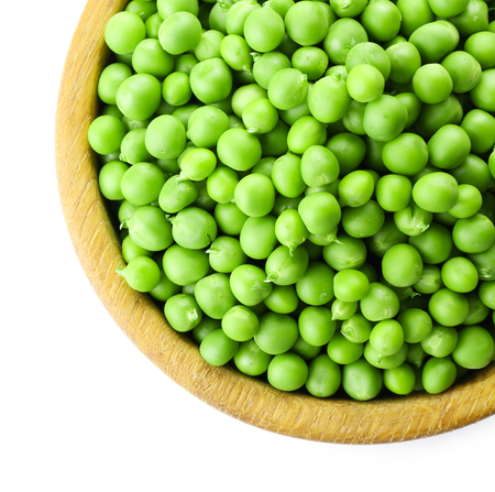 Fresh green peas in bowl isolated on whiteの写真素材