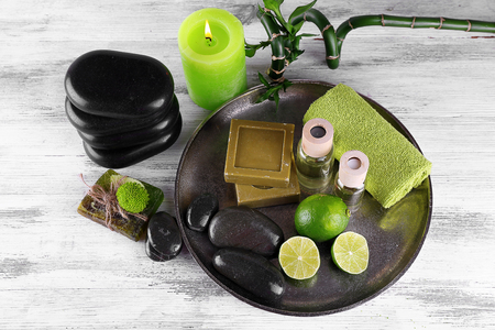 Beautiful composition of spa treatment on tray, on light backgroundの写真素材