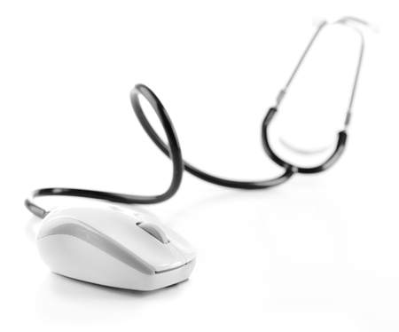 Stethoscope and computer mouse isolated on whiteの写真素材