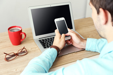 Man using mobile phone in office