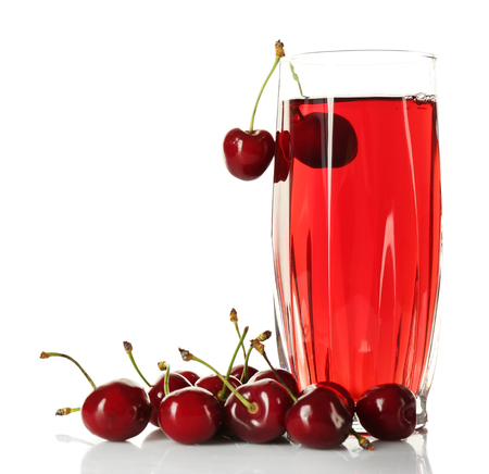 Glass of fresh juice with cherries isolated on whiteの写真素材