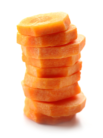Sliced carrot isolated on whiteの写真素材