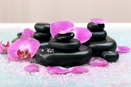 Violet orchid and zen stones close-upの写真素材