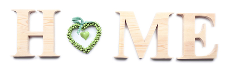 Decorative letters forming word HOME with heart isolated on whiteの写真素材
