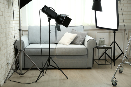 Photo studio with modern interior and lighting equipmentの写真素材