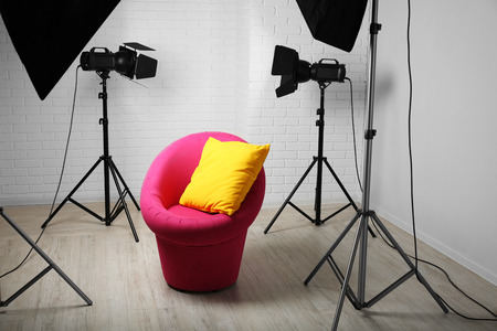 Photo studio with modern interior and lighting equipmentの写真素材