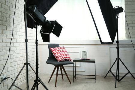 Photo studio with modern interior and lighting equipmentの写真素材