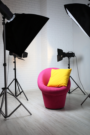Photo studio with modern interior and lighting equipmentの写真素材